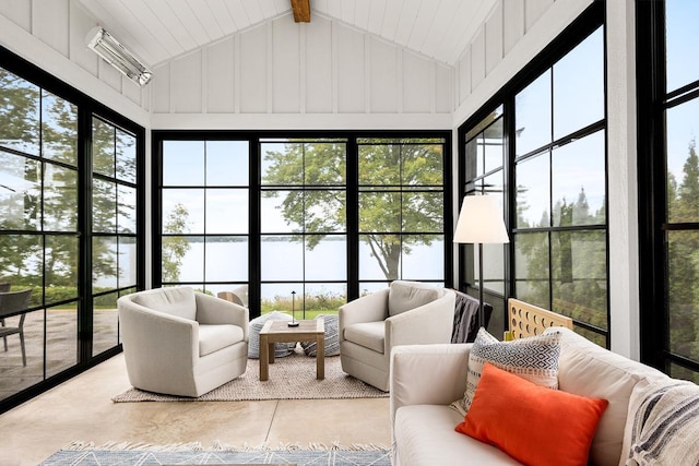 sunroom / solarium with a wealth of natural light and vaulted ceiling with beams