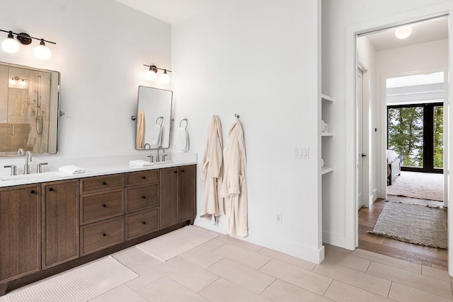 bathroom featuring vanity and built in features