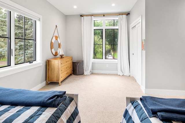 bedroom with light colored carpet