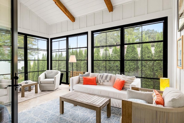 sunroom with vaulted ceiling with beams