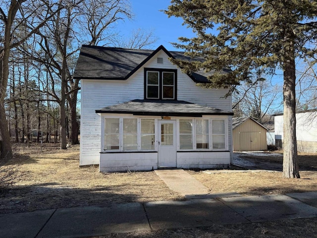 view of front facade with a sunroom