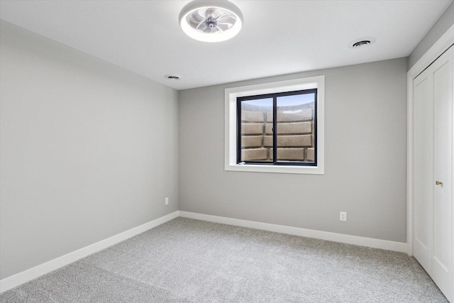 empty room with carpet flooring