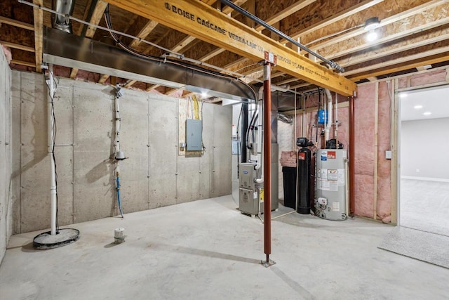 basement featuring water heater, heating unit, and electric panel