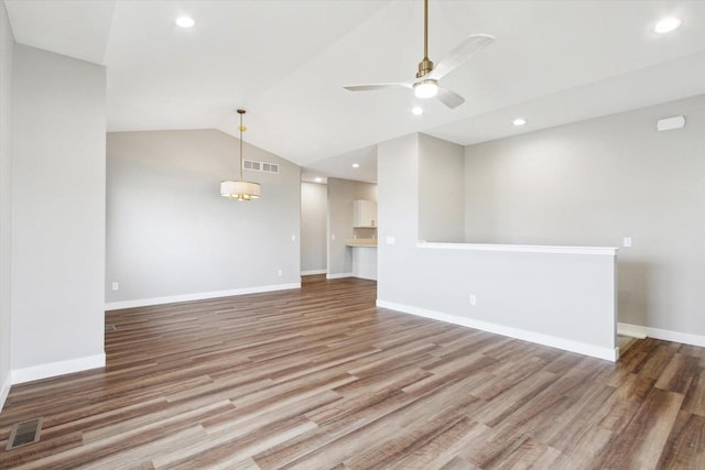 unfurnished living room featuring lofted ceiling, wood-type flooring, and ceiling fan