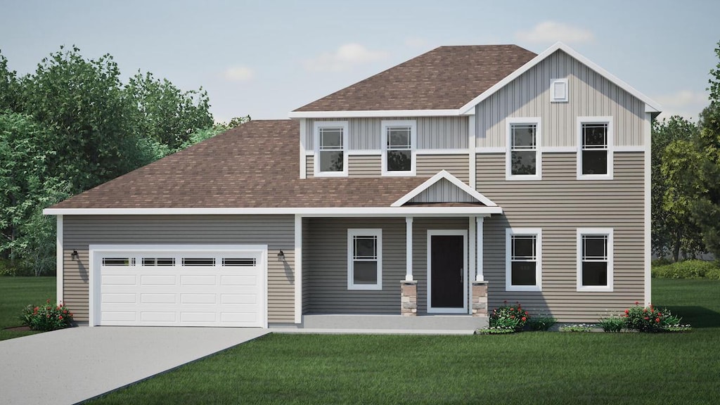 view of front of home featuring a garage and a front yard