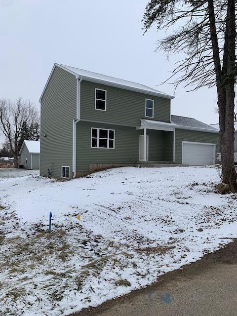 front facade with a garage