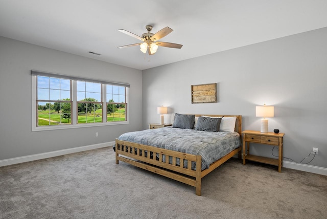 bedroom featuring light colored carpet and ceiling fan