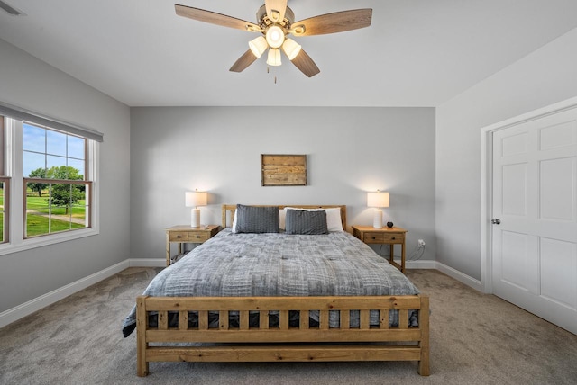 bedroom with light colored carpet and ceiling fan