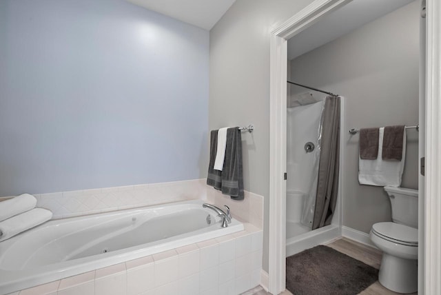 bathroom with wood-type flooring, toilet, and separate shower and tub