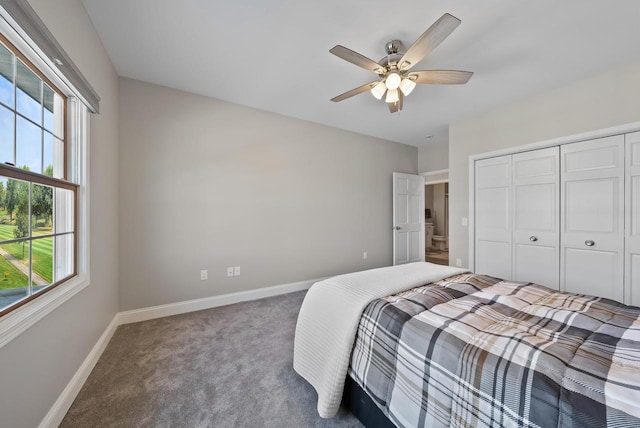 bedroom with ceiling fan, carpet flooring, and a closet