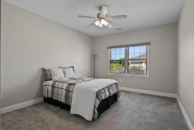 bedroom featuring dark carpet and ceiling fan