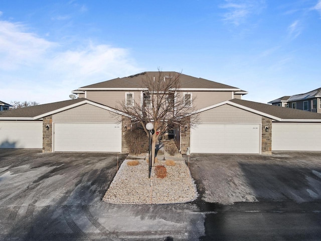 front of property with a garage