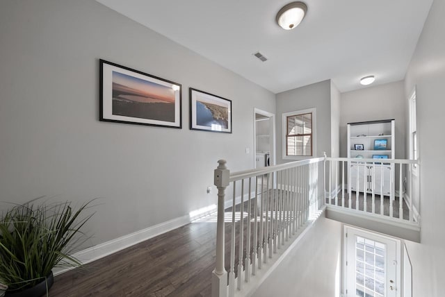 hallway featuring dark hardwood / wood-style floors