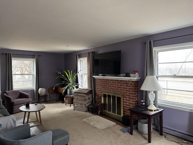 carpeted living room featuring a brick fireplace, a healthy amount of sunlight, and baseboard heating