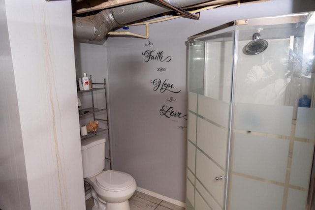 bathroom with a shower with shower door, tile patterned floors, and toilet