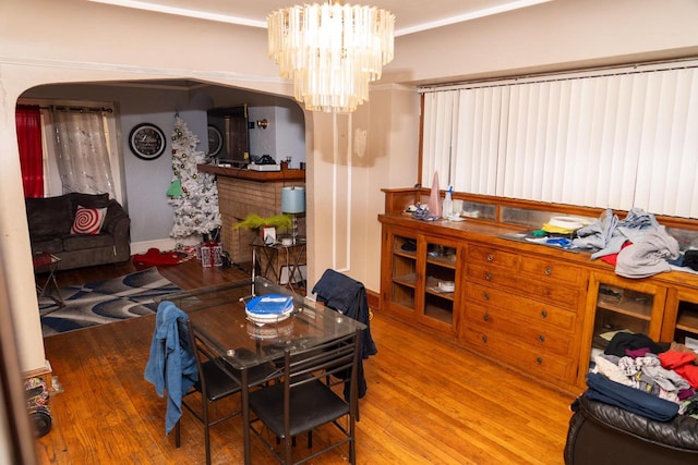 dining room with a notable chandelier and hardwood / wood-style flooring