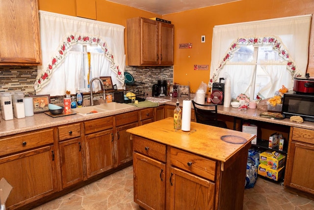 kitchen featuring sink and decorative backsplash