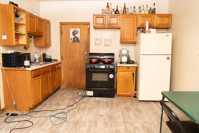 kitchen with sink and black appliances