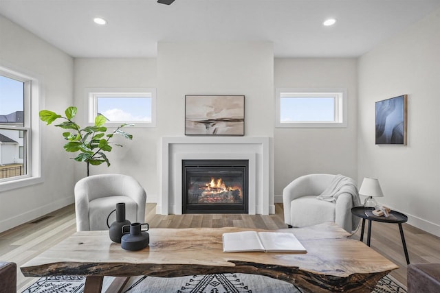 sitting room with light hardwood / wood-style floors