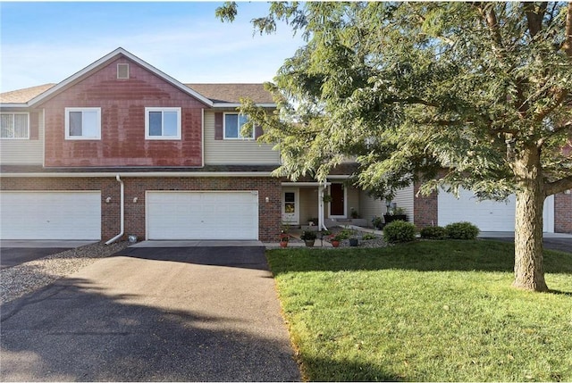 view of front of property featuring a garage and a front lawn