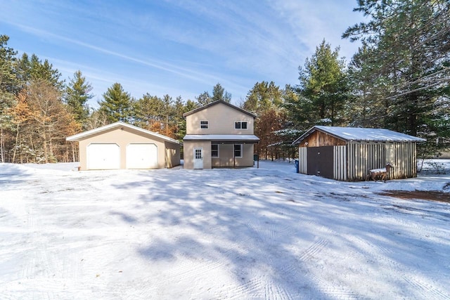 view of front of house with an outbuilding and a garage