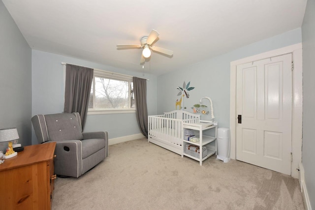 carpeted bedroom with ceiling fan