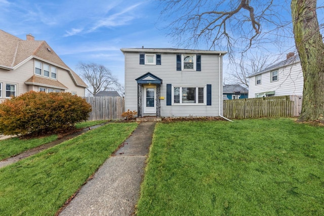 view of front of home with a front lawn