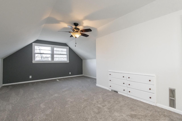 bonus room with lofted ceiling, carpet floors, and ceiling fan