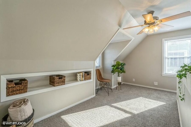 sitting room featuring ceiling fan, vaulted ceiling, and carpet