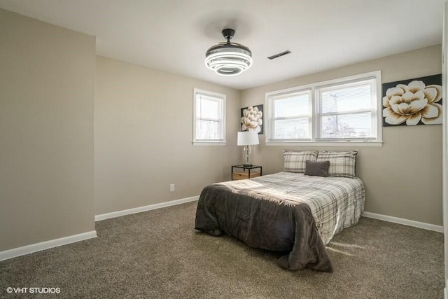 bedroom with dark carpet