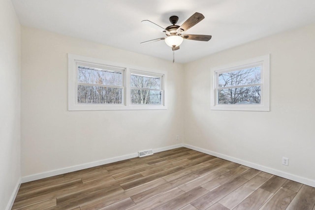 unfurnished room featuring ceiling fan and wood-type flooring