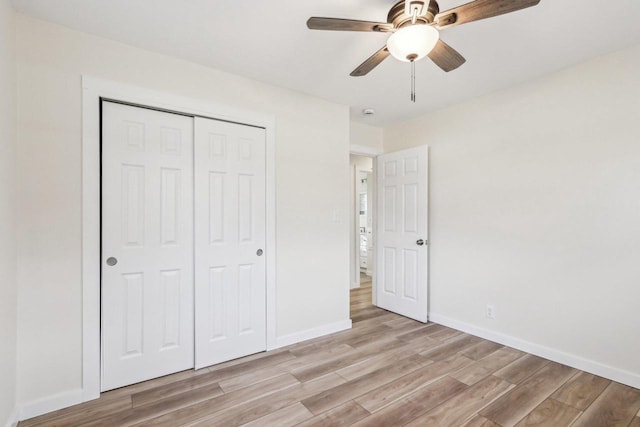 unfurnished bedroom with a closet, ceiling fan, and light hardwood / wood-style flooring