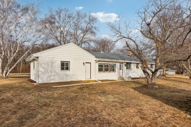 view of front of home with a front yard