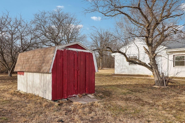 view of outdoor structure featuring a lawn