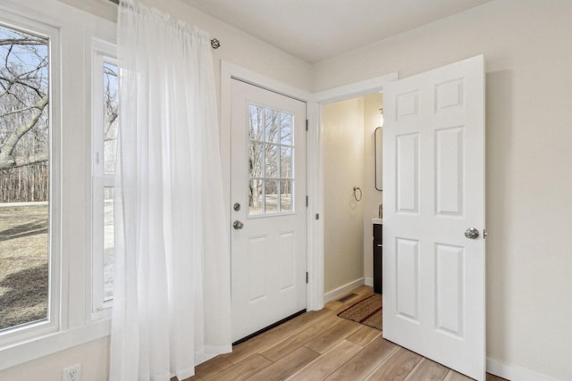 entryway with a healthy amount of sunlight and light wood-type flooring