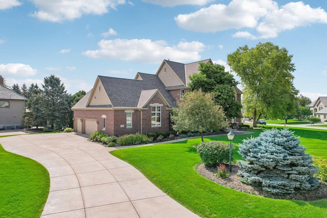 craftsman house featuring a garage and a front lawn