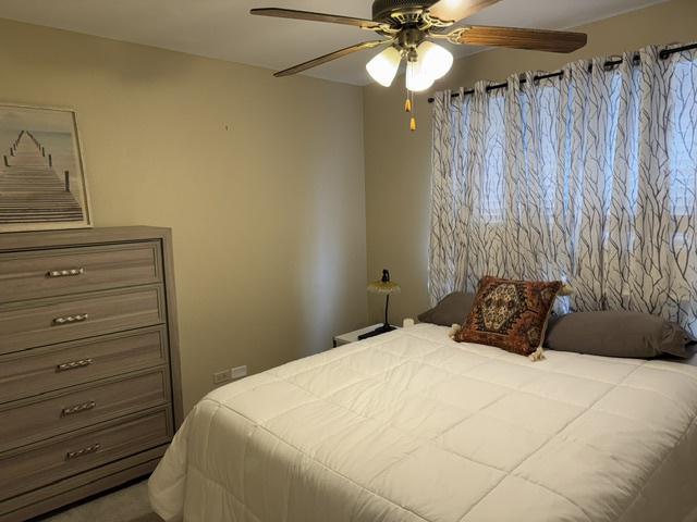 bedroom featuring ceiling fan