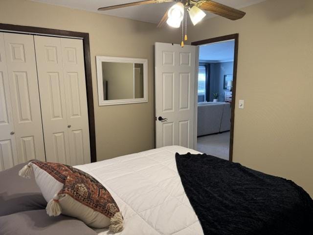 bedroom with carpet flooring, ceiling fan, and a closet