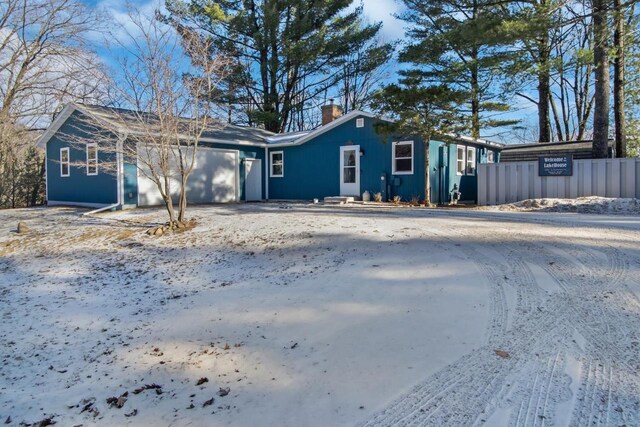 N152 Czech Dr, Coloma, WI 54930 - view of front facade featuring a chimney and a garage
