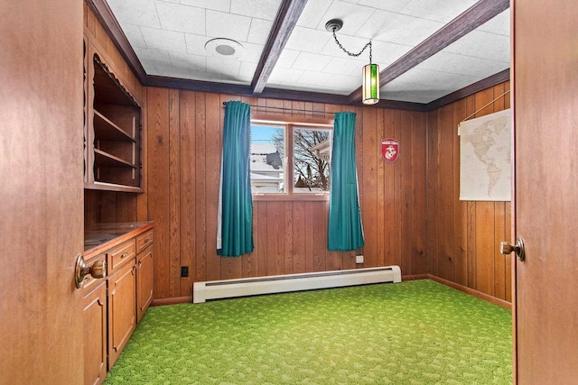 playroom with beamed ceiling, a baseboard radiator, wooden walls, and carpet