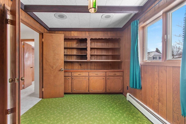 interior space featuring a baseboard radiator and wood walls