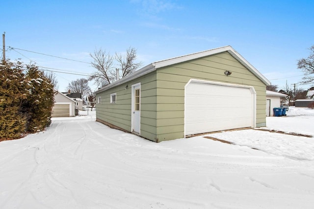 view of snow covered garage