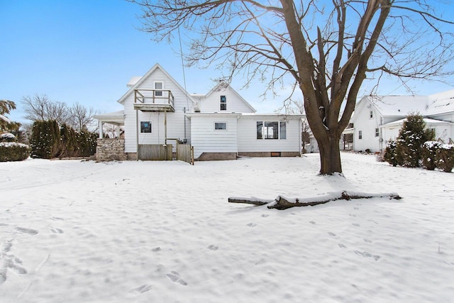 view of snow covered house