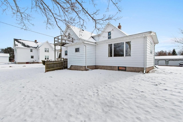 view of snow covered house