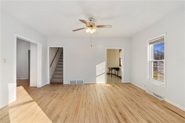 unfurnished room with ceiling fan and light hardwood / wood-style flooring