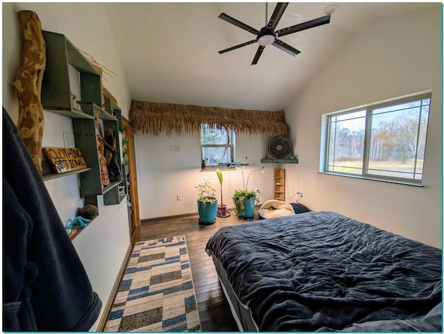 3067 N River Rd, Oconto, WI 54153 - bedroom with a ceiling fan, baseboards, vaulted ceiling, and wood finished floors