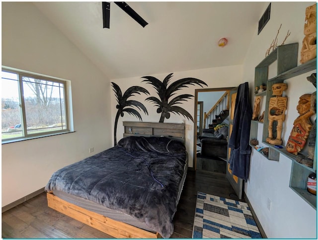 3067 N River Rd, Oconto, WI 54153 - bedroom with visible vents, ceiling fan, vaulted ceiling, wood finished floors, and baseboards