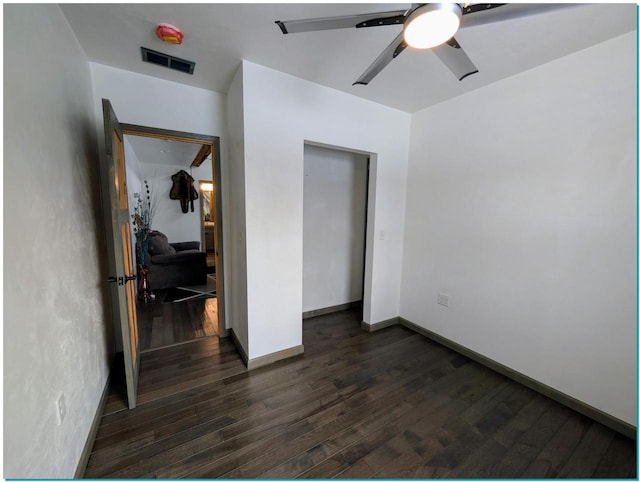 3067 N River Rd, Oconto, WI 54153 - bedroom featuring ceiling fan, baseboards, visible vents, and dark wood finished floors