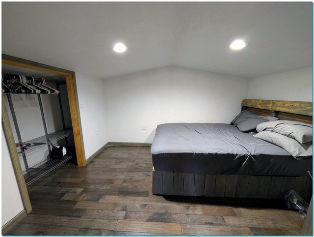 3067 N River Rd, Oconto, WI 54153 - bedroom featuring dark wood-style floors, vaulted ceiling, recessed lighting, and baseboards