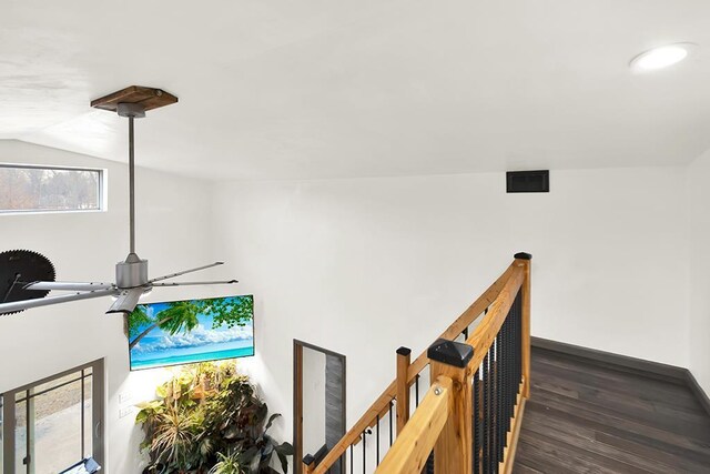 3067 N River Rd, Oconto, WI 54153 - corridor with dark wood-style floors, vaulted ceiling, and an upstairs landing